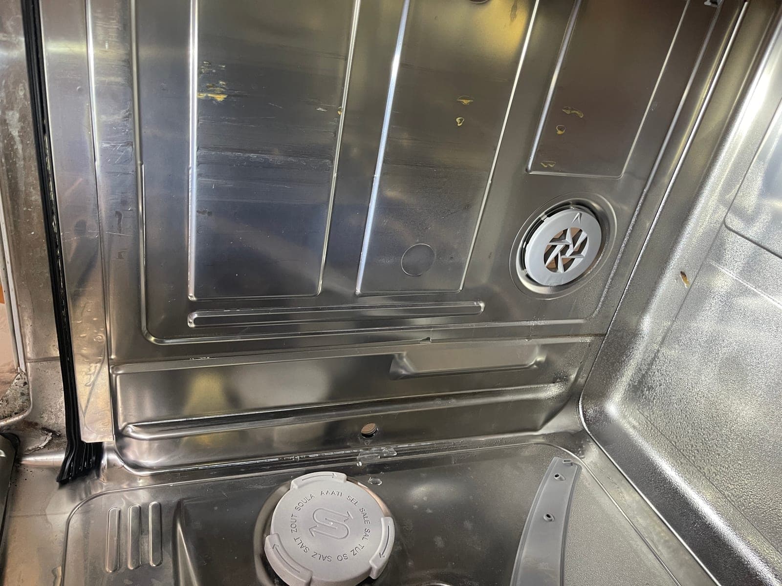 The base of a dishwasher tub after a service clean.