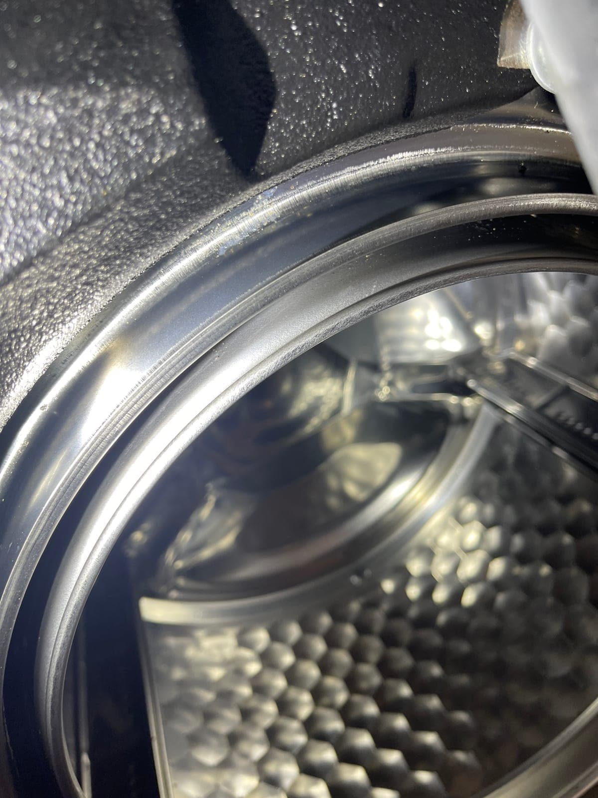 The drum and outer tub of a front loader during a door seal replacement.