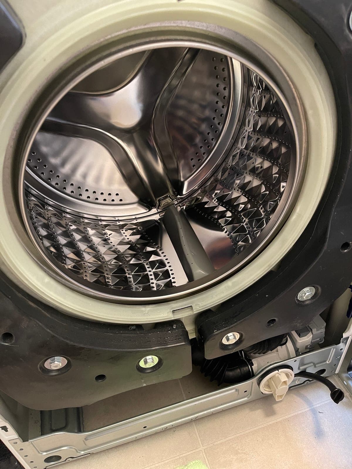 A front loader drum with the front panel off, mid door seal replacement.