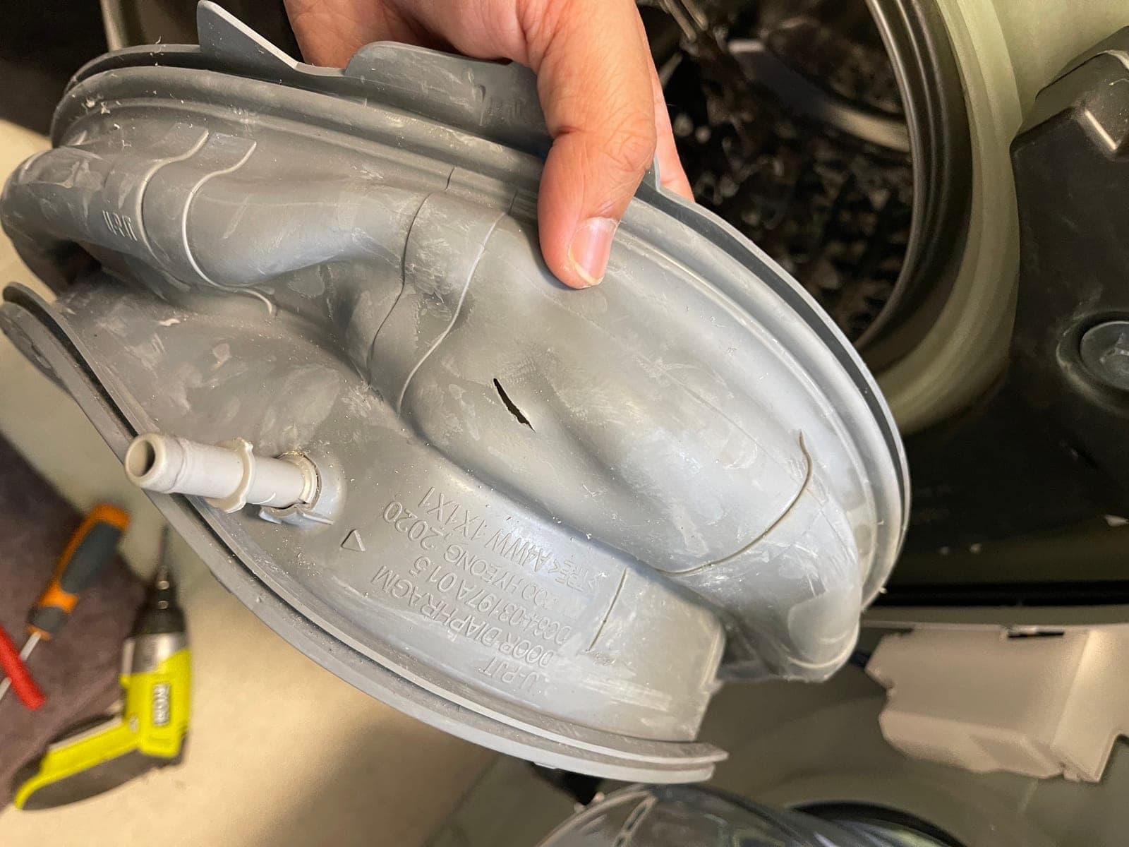 The sump hose held up and checked along its length for a blockage.