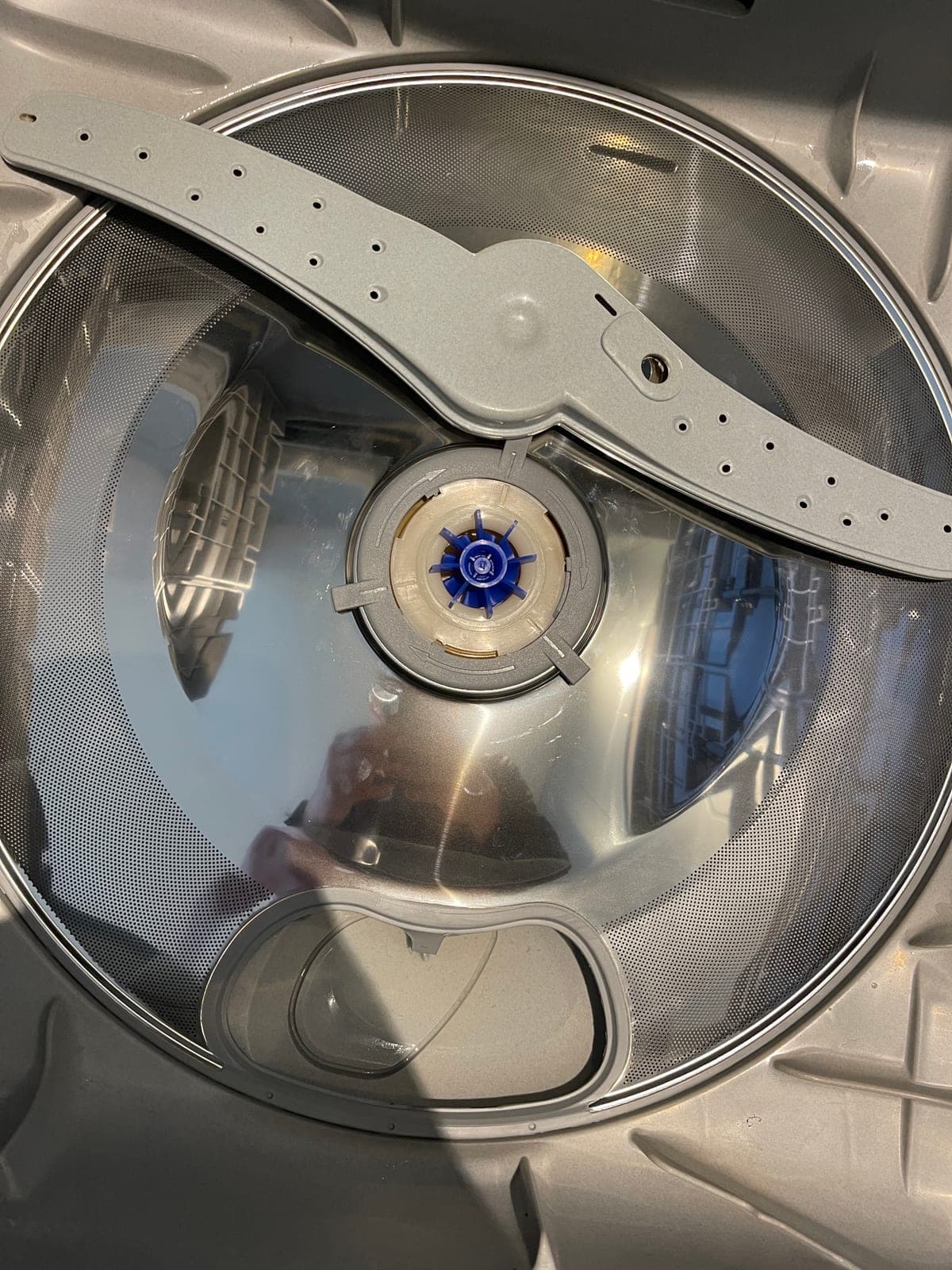 Inside a drawer dishwasher, opened up for a service.